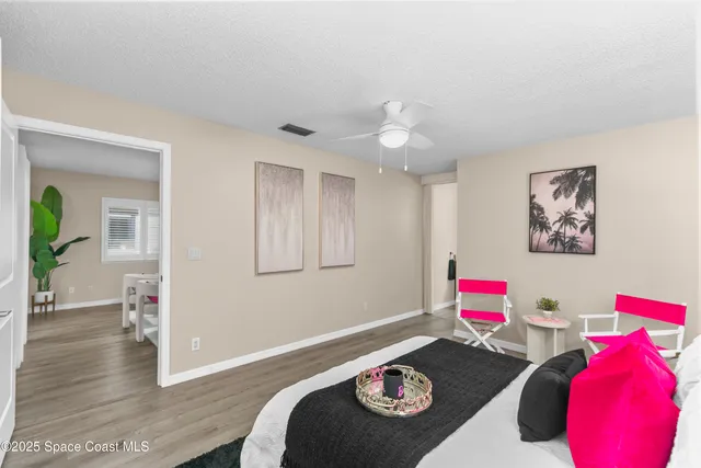 a view of a room with wooden floor and toys