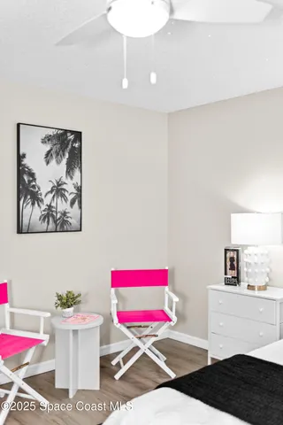 a living room with a couch and cabinets