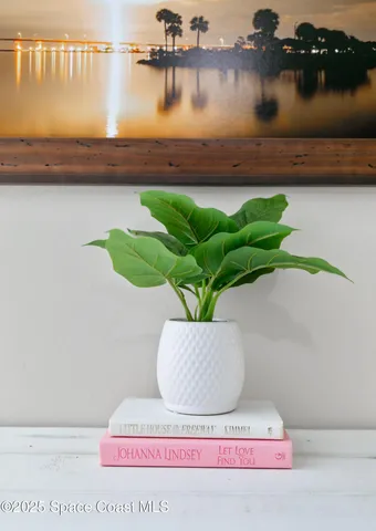 a bedroom with furniture and a picture of door