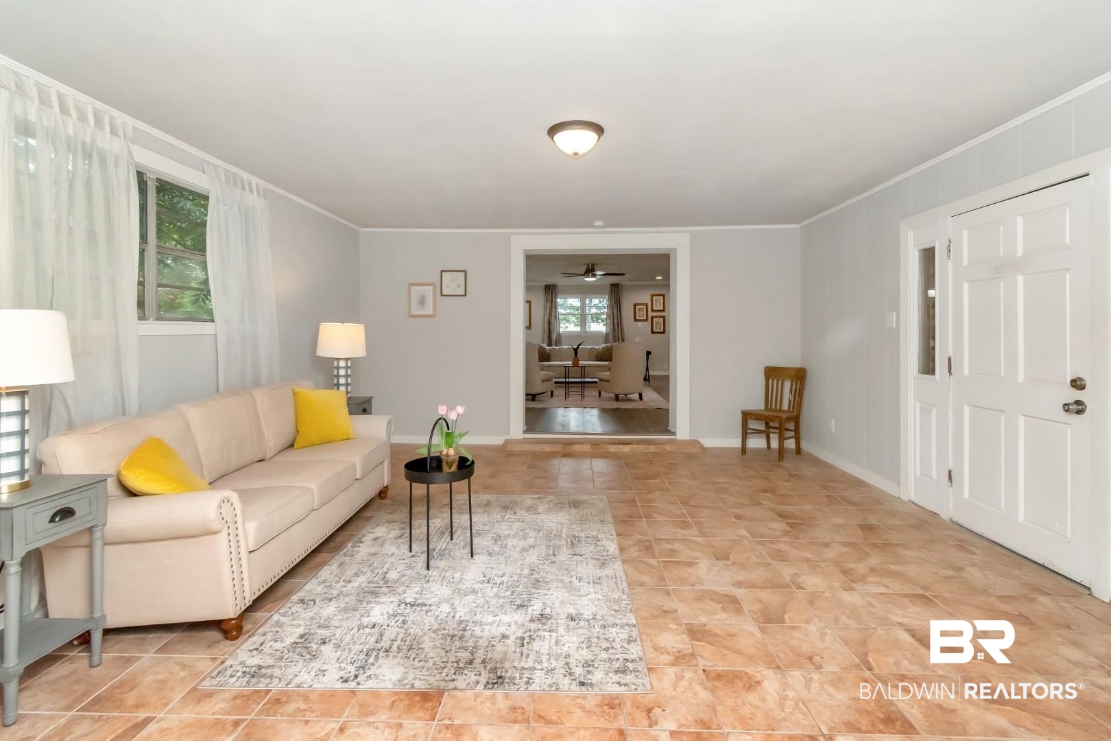 1334 Leroy Stevens Road Mobile, AL 36695 - Photo 17 of 46 Living room with a ceiling fan and crown molding