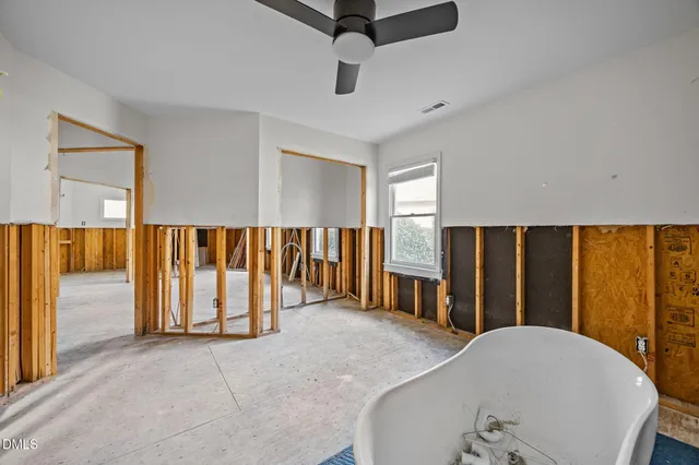 a view of an empty room with a couch