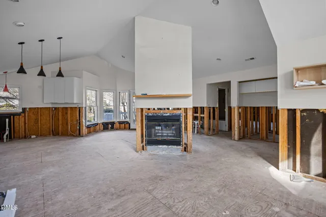 a view of a livingroom with furniture and a fireplace