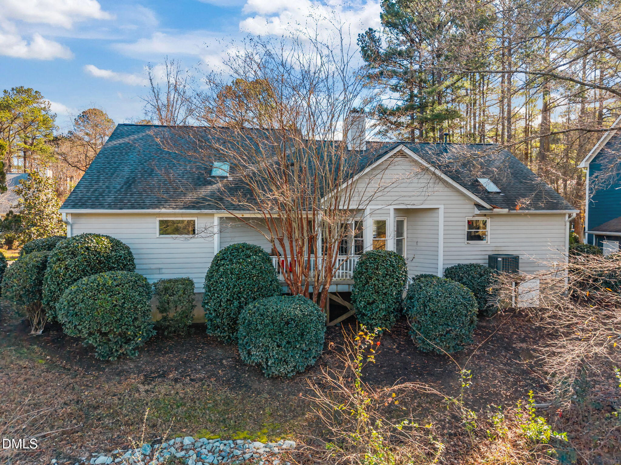 105 Riverbirch Point Carrboro, NC 27510 - Photo 22 of 32 a view of a small house with a large tree and plants