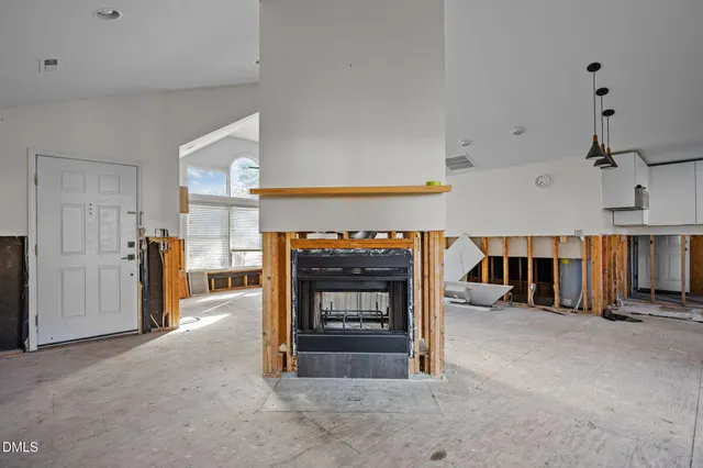 a view of a livingroom with furniture and fireplace