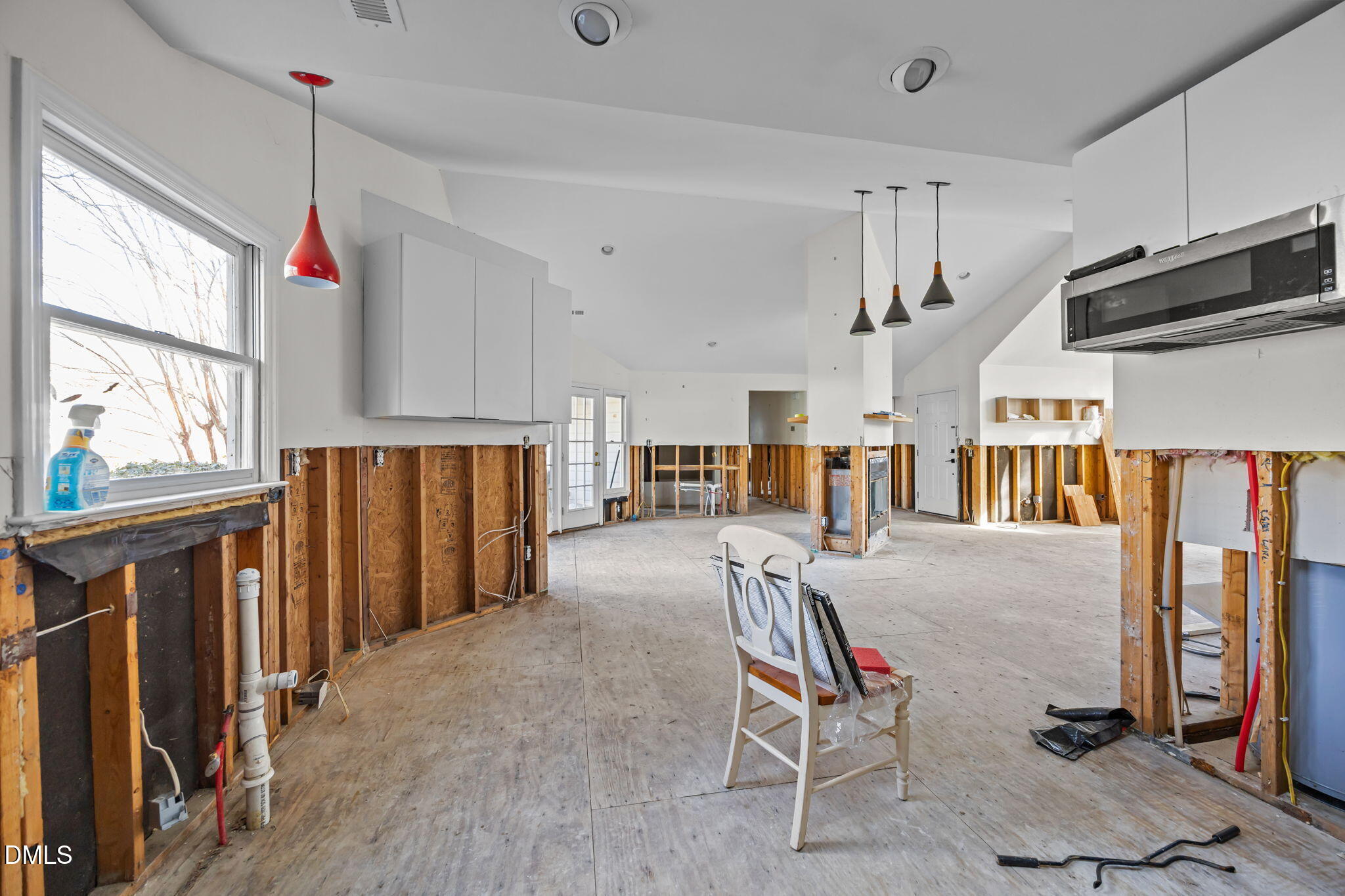 105 Riverbirch Point Carrboro, NC 27510 - Photo 5 of 32 a living room with furniture a flat screen tv and a window
