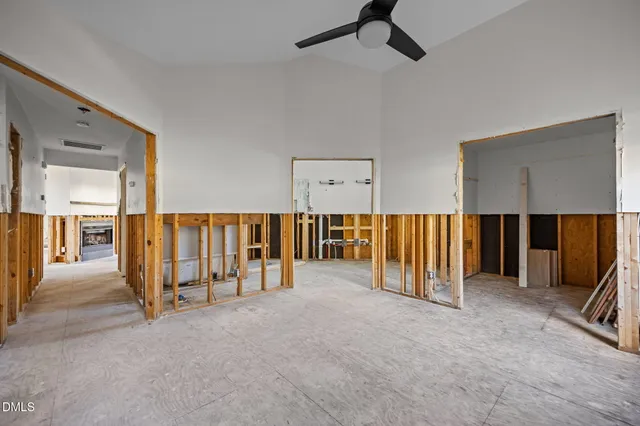 a view of an empty room and furniture