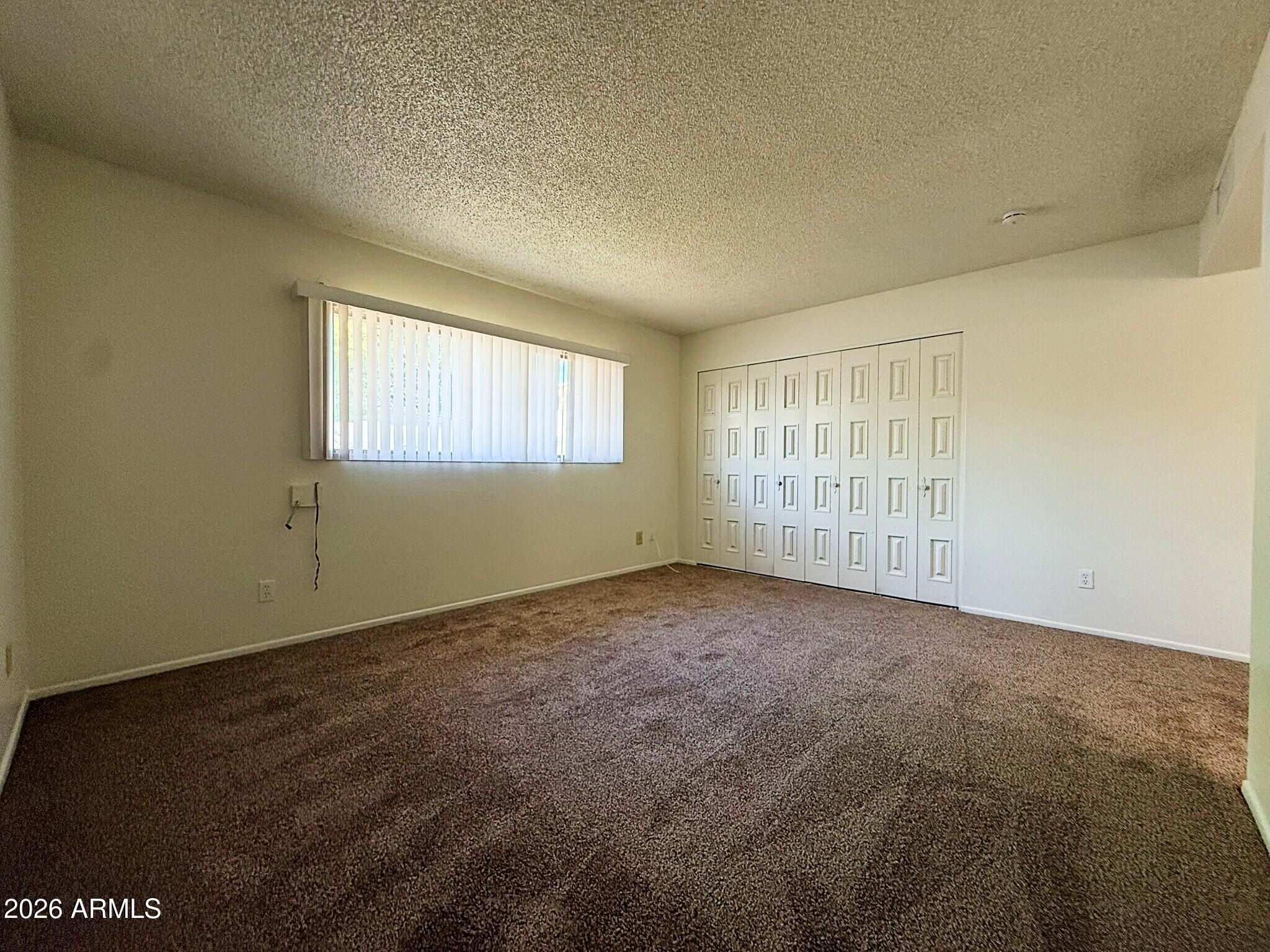 5208 West Calavar Road Glendale, AZ 85306 - Photo 11 of 39 an empty room with windows
