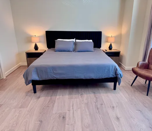 a bedroom with a bed and chair