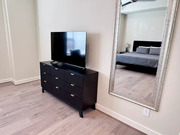 a bathroom with a double vanity sink a mirror and a shower