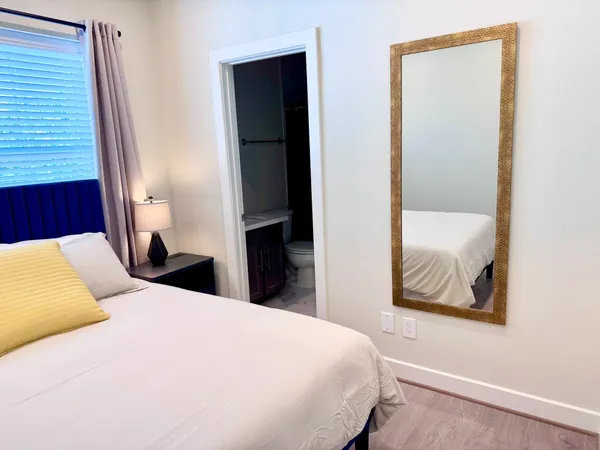 a hallway with sliding door and stairs