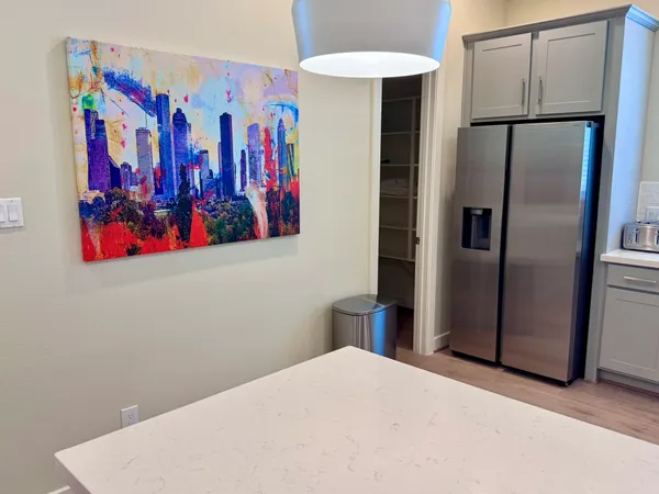 a very nice looking room with a painting on the wall