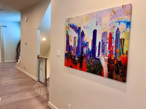a view of walk in closet with clothes