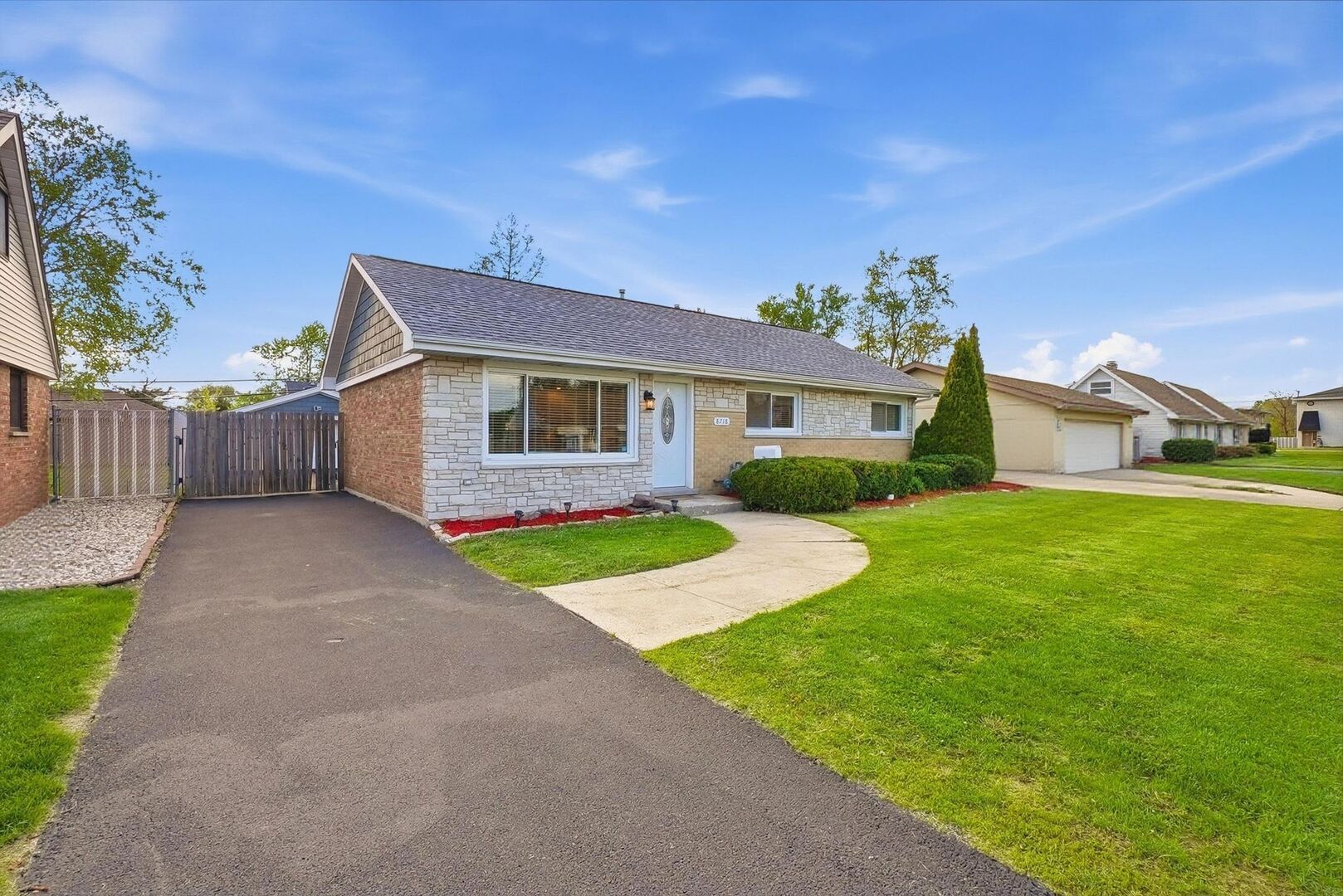 8718 Cranbrook Lane Bridgeview, IL 60455 - Photo 2 of 24 a view of an house with backyard space and garden