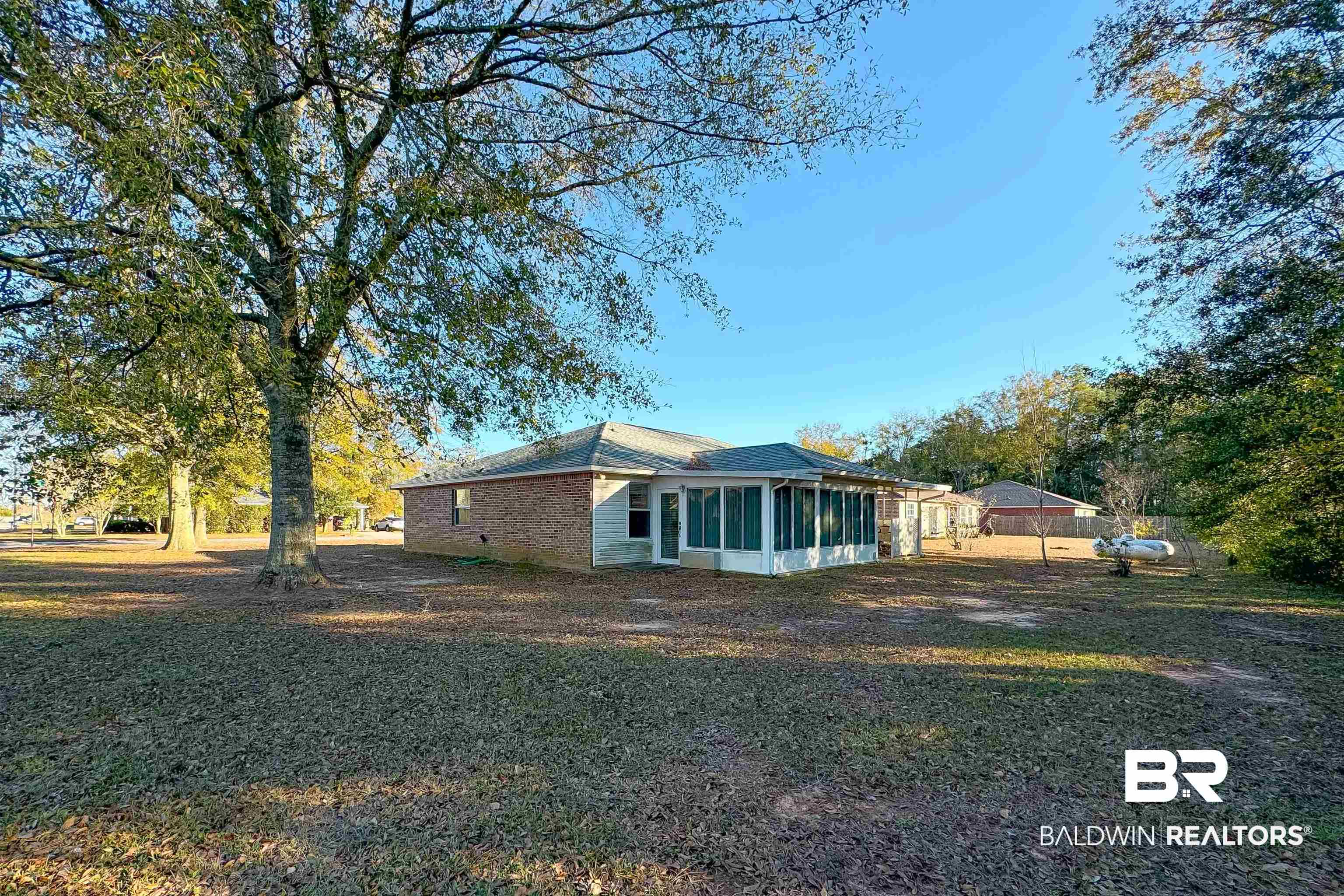 1 Bay Circle Foley, AL 36535 - Photo 25 of 28 View of home's exterior with sunroom and yard