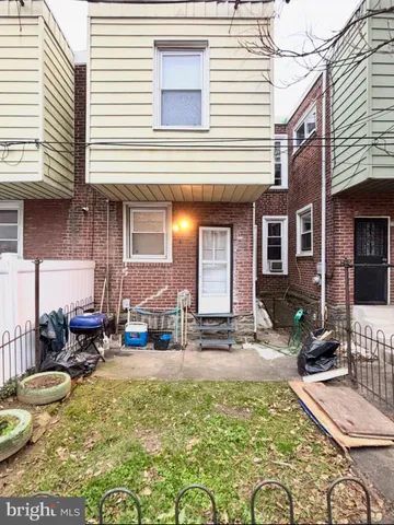 a view of water fountain in front of a house