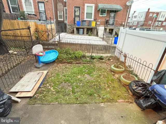 a view of a chair and table in the patio