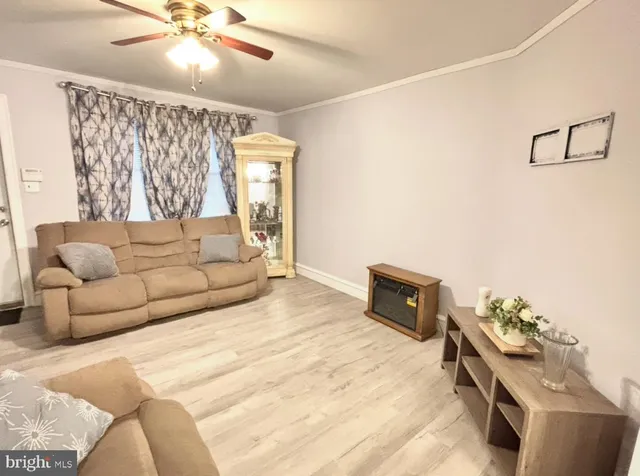 a bedroom with furniture and a wooden floor