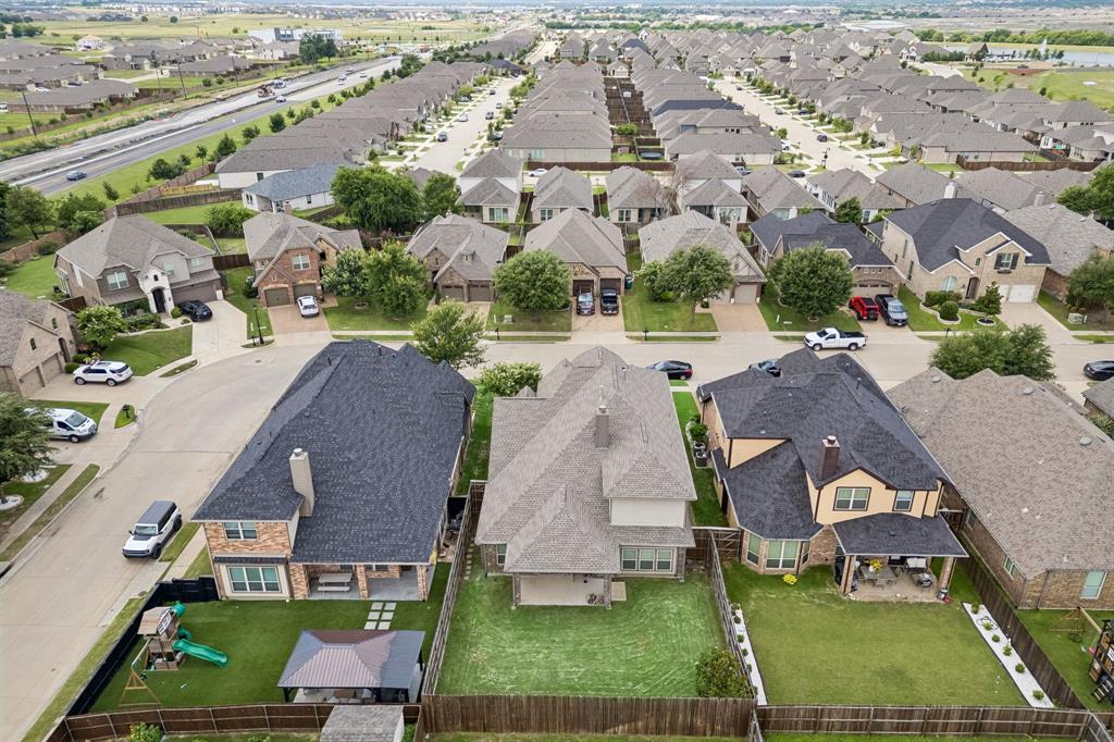 1014 Dunhill Lane Forney, TX 75126 - Photo 26 of 38 Expansive backyard featuring a covered patio