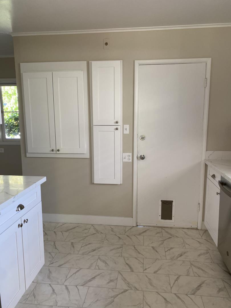 139 Louise Lane San Mateo, CA 94403 - Photo 10 of 11 a view of an empty room with window and cabinet