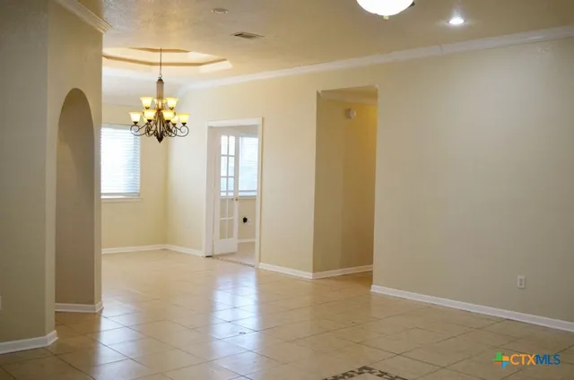 a kitchen with cabinets a sink and stainless steel appliances