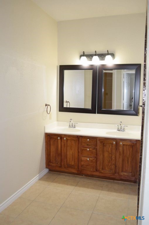 4411 Kit Carson Trail Killeen, TX 76542 - Photo 30 of 45 a bathroom with a sink and a mirror