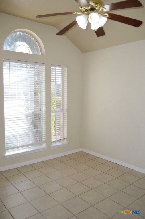4411 Kit Carson Trail Killeen, TX 76542 - Photo 34 of 45 an empty room with wooden floor fan and windows