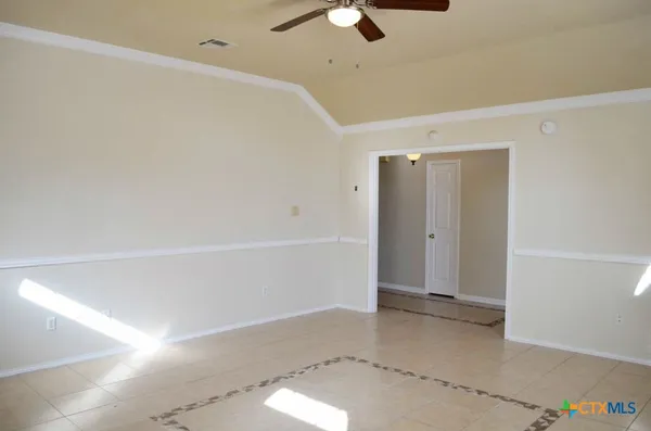 a view of an empty room with a window
