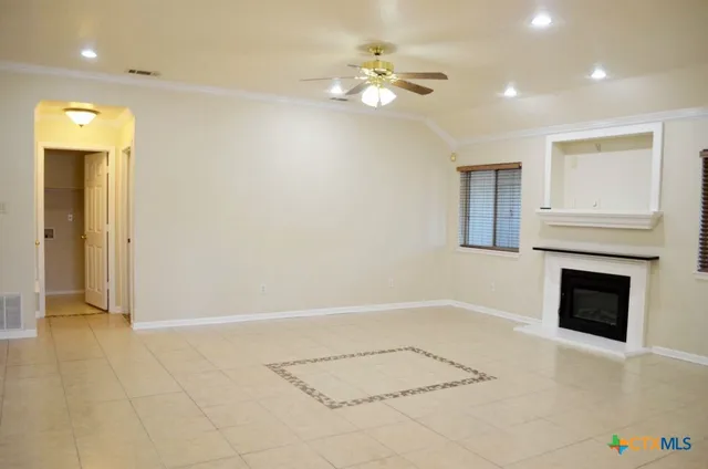 a kitchen with a refrigerator and a sink
