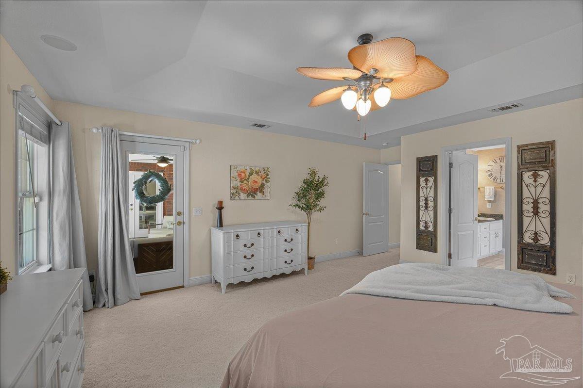 5684 Dunbar Circle Milton, FL 32583 - Photo 25 of 53 a bedroom with a bed and a chandelier