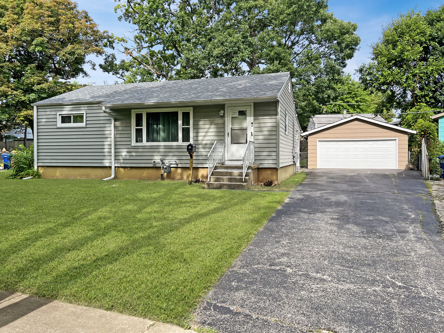 1926 Chippewa Road Waukegan, IL 60087 - Photo 1 of 13 a front view of house with yard and green space