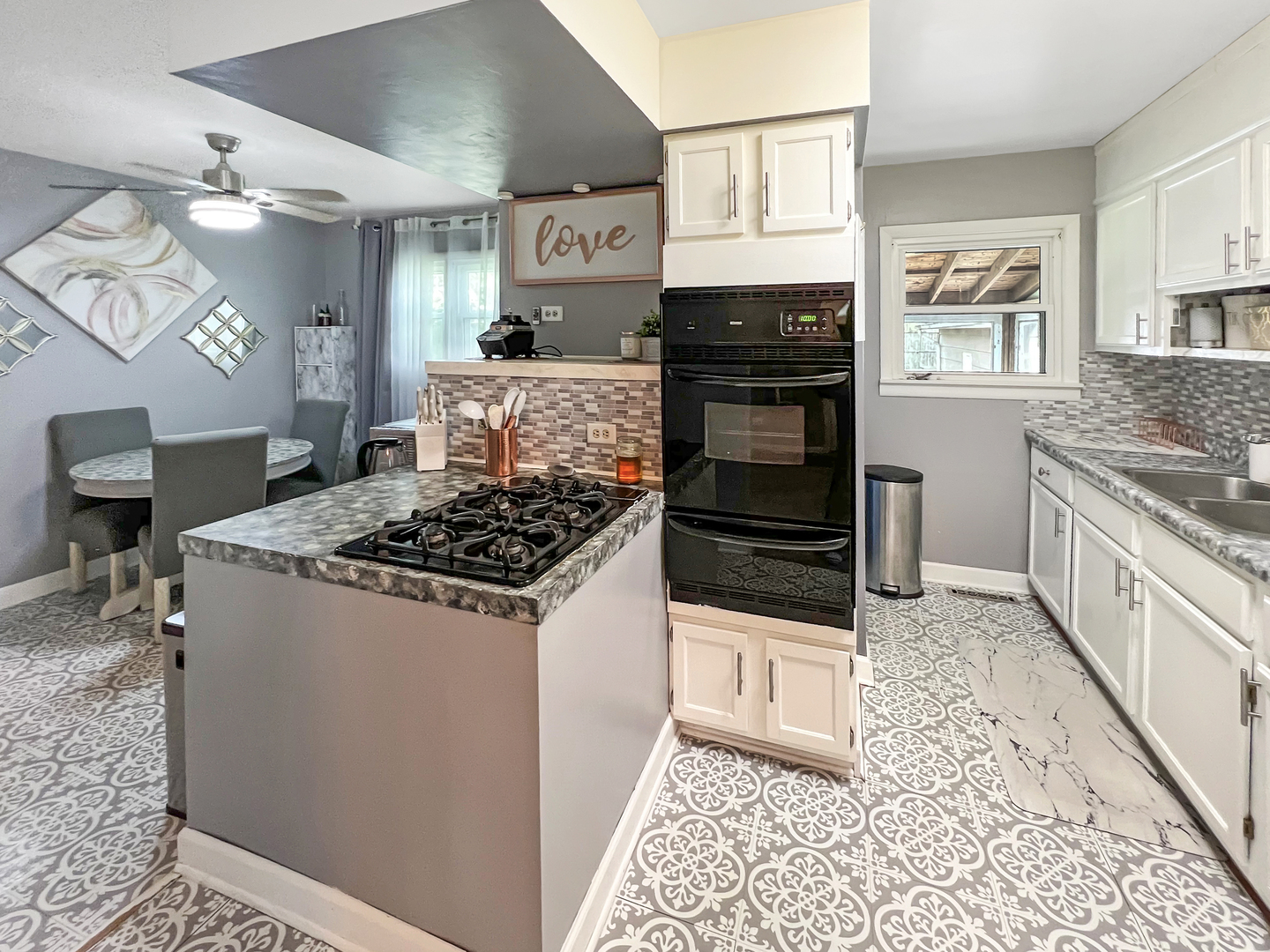 1926 Chippewa Road Waukegan, IL 60087 - Photo 11 of 13 a kitchen with stainless steel appliances a stove a refrigerator and cabinets