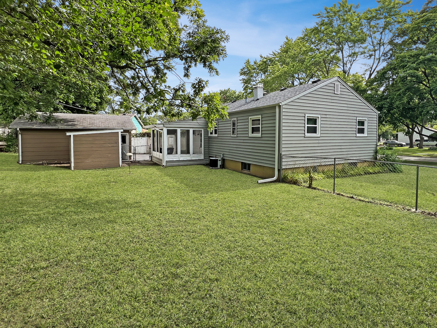 1926 Chippewa Road Waukegan, IL 60087 - Photo 3 of 13 a view of a house with a yard and sitting area