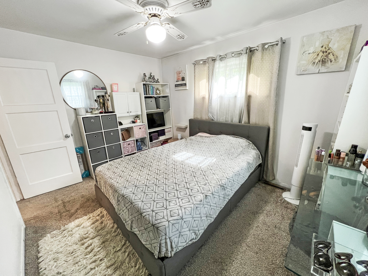 1926 Chippewa Road Waukegan, IL 60087 - Photo 7 of 13 a bedroom with a bed and dresser with mirror