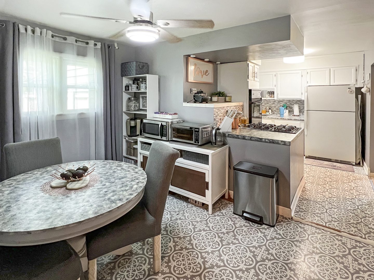 1926 Chippewa Road Waukegan, IL 60087 - Photo 10 of 13 a kitchen with a table chairs stove and refrigerator