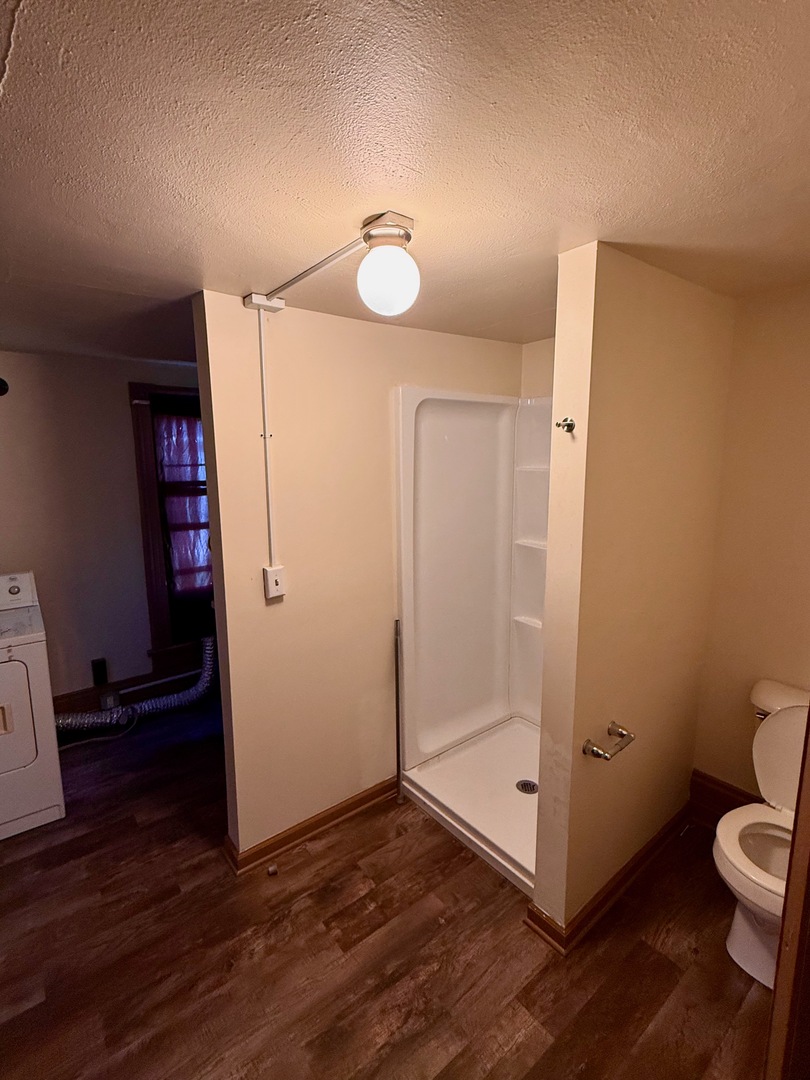 913 West 4th Street Dixon, IL 61021 - Photo 7 of 8 a bathroom with a toilet and a shower
