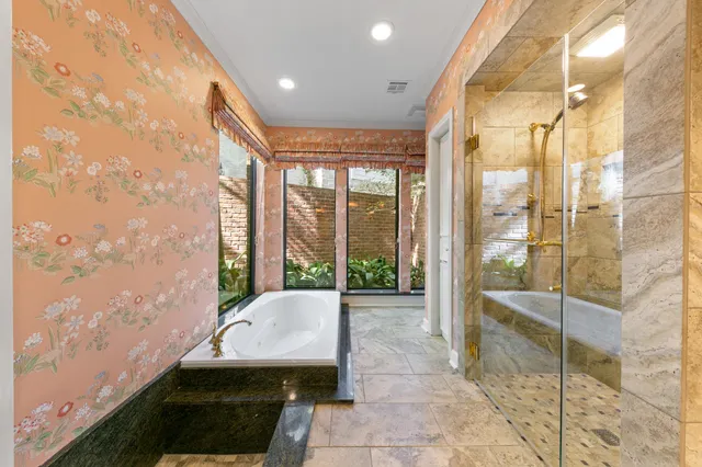 a large kitchen with granite countertop a sink and cabinets