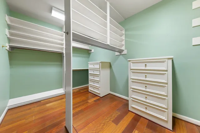 a dining room with furniture and a floor to ceiling window