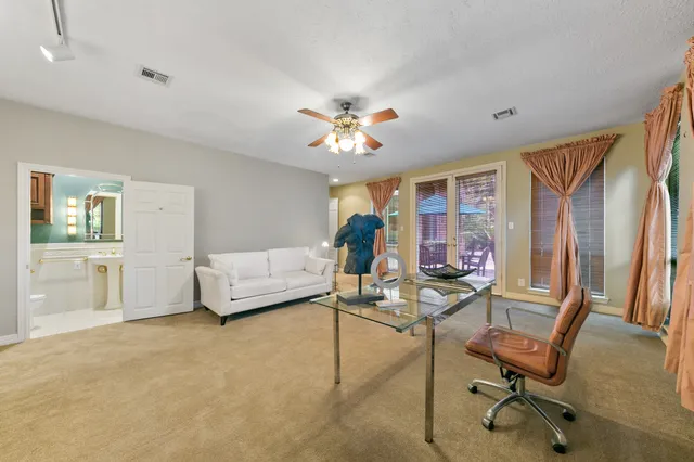 a bathroom with a shower and a sink