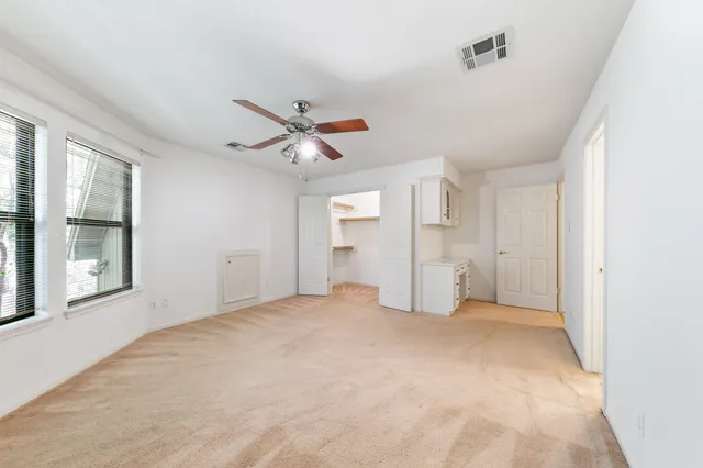 a view of a hallway with windows