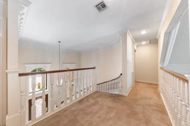 a view of a tables and chairs under an umbrella in backyard