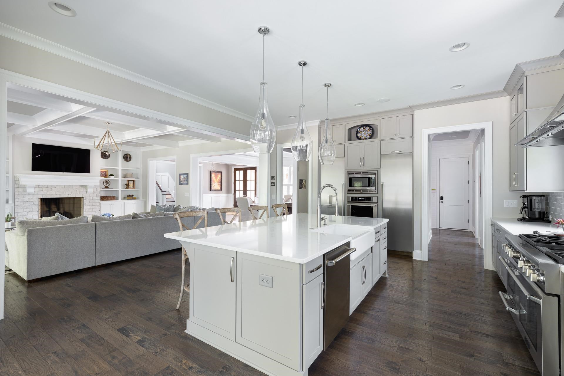 116 Turner Ridge Circle Durham, NC 27713 - Photo 15 of 63 a large white kitchen with a stove top oven a sink a counter space and wooden floor