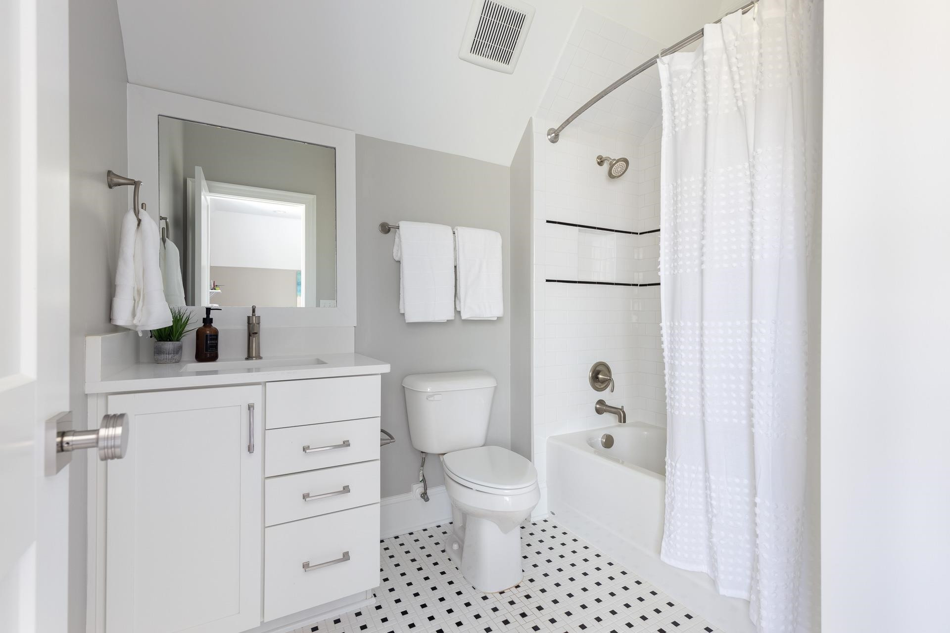 116 Turner Ridge Circle Durham, NC 27713 - Photo 41 of 63 a bathroom with a sink a toilet and a mirror