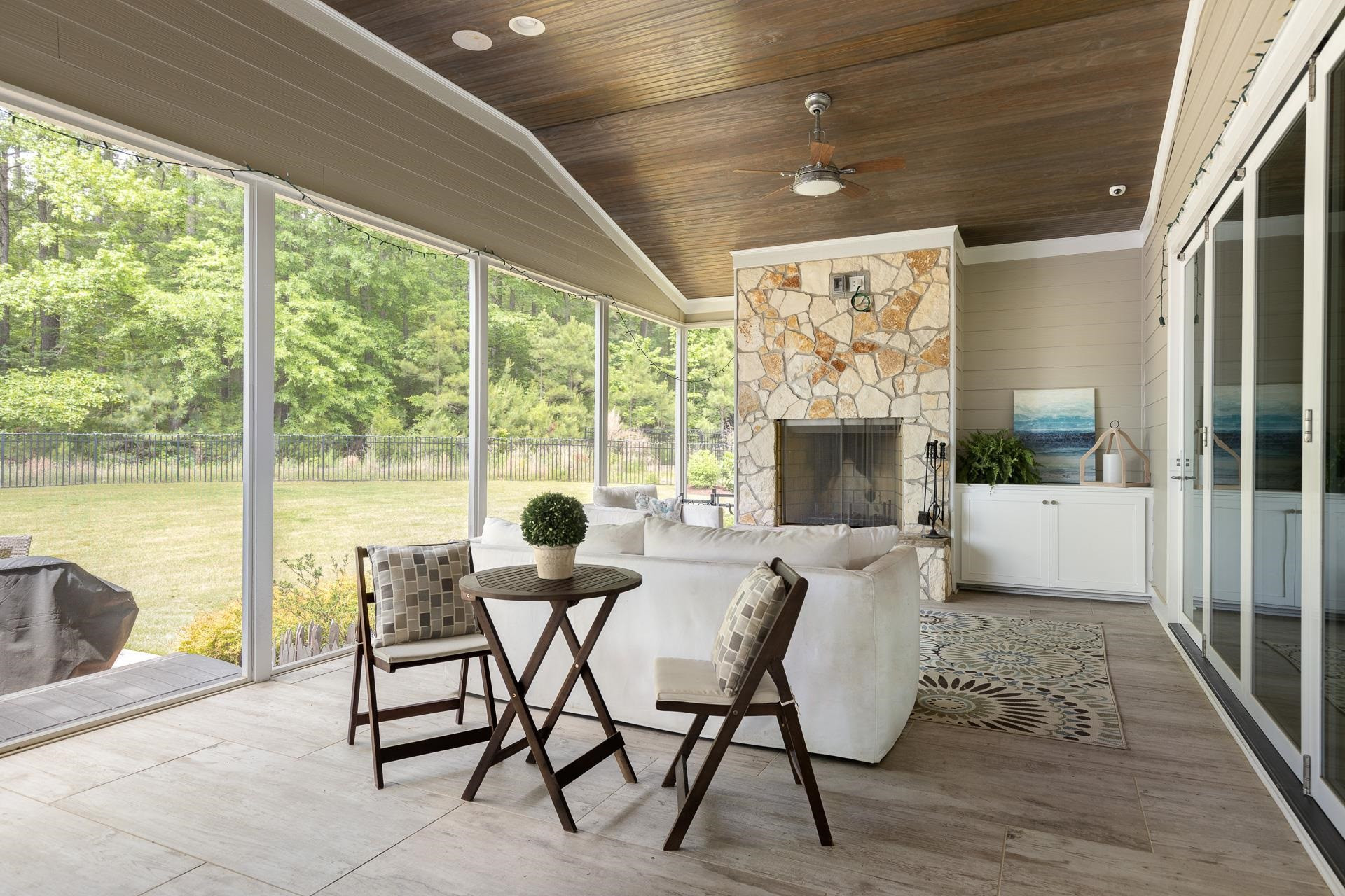 116 Turner Ridge Circle Durham, NC 27713 - Photo 55 of 63 a dining room with furniture large windows and wooden floor