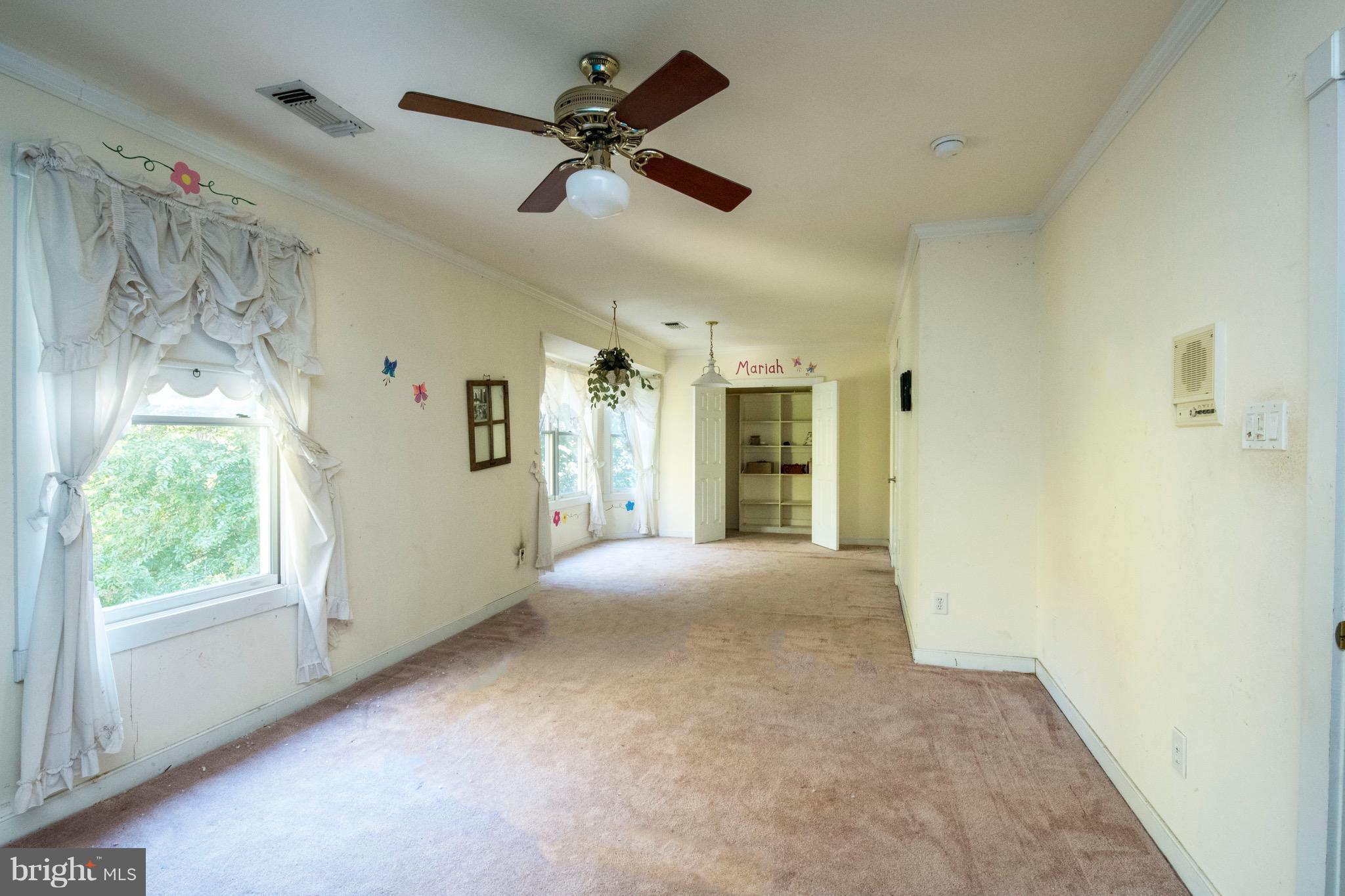 670 Hillmeade Road Edgewater, MD 21037 - Photo 22 of 30 a view of a livingroom with a ceiling fan and window