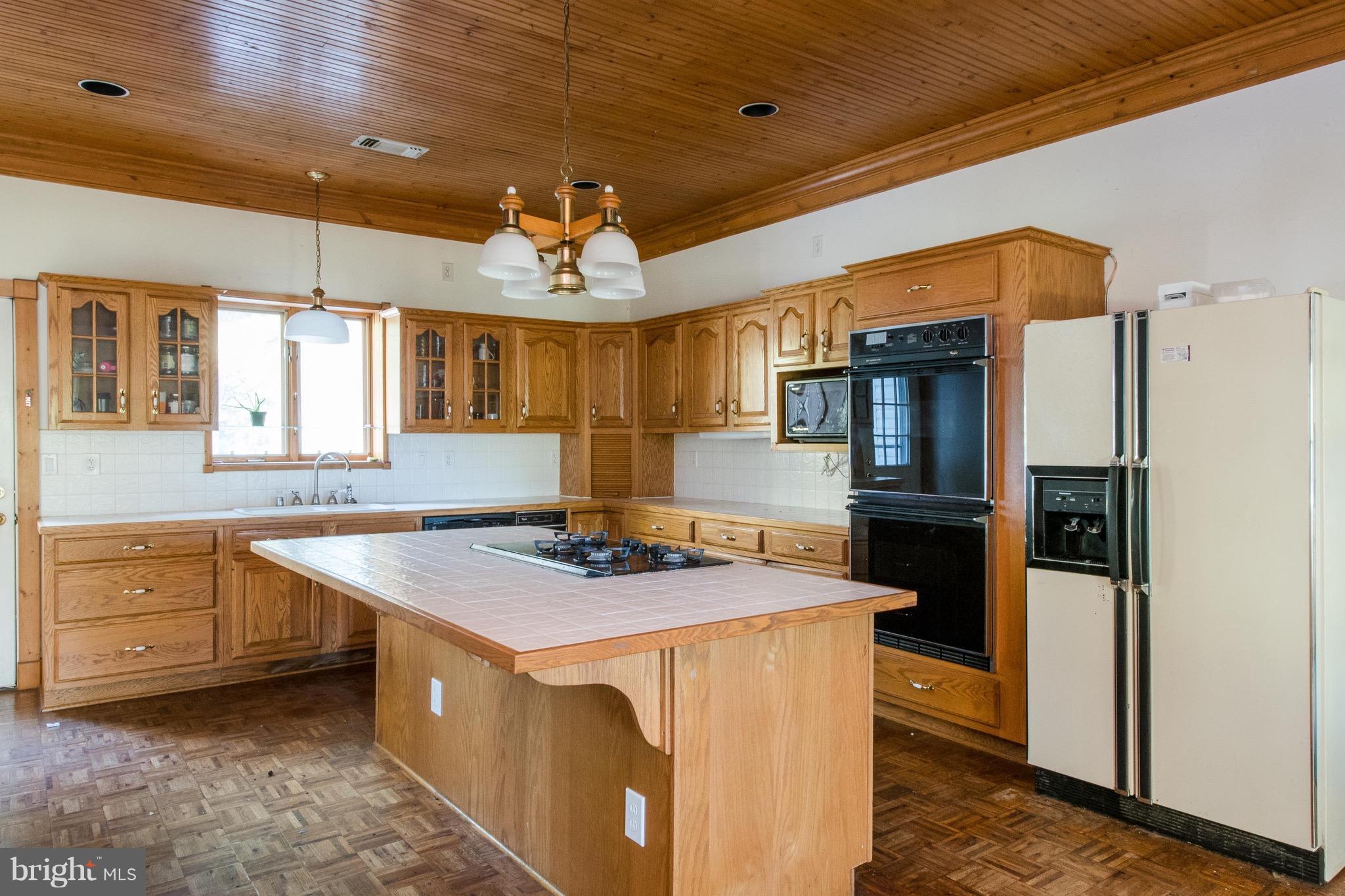 670 Hillmeade Road Edgewater, MD 21037 - Photo 5 of 30 a kitchen with stainless steel appliances granite countertop a sink a stove and a refrigerator