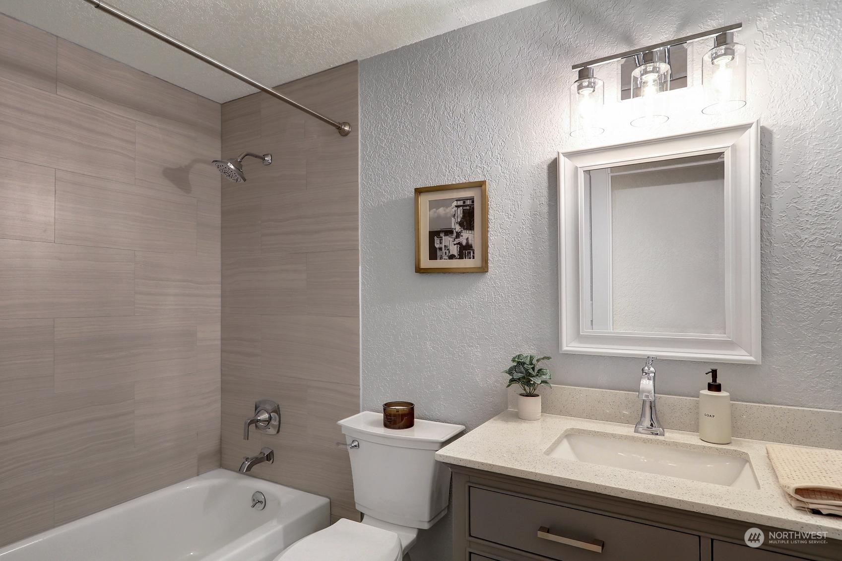 2029 Timber Trail Bothell, WA 98012 - Photo 16 of 24 a bathroom with a sink mirror toilet and bathtub