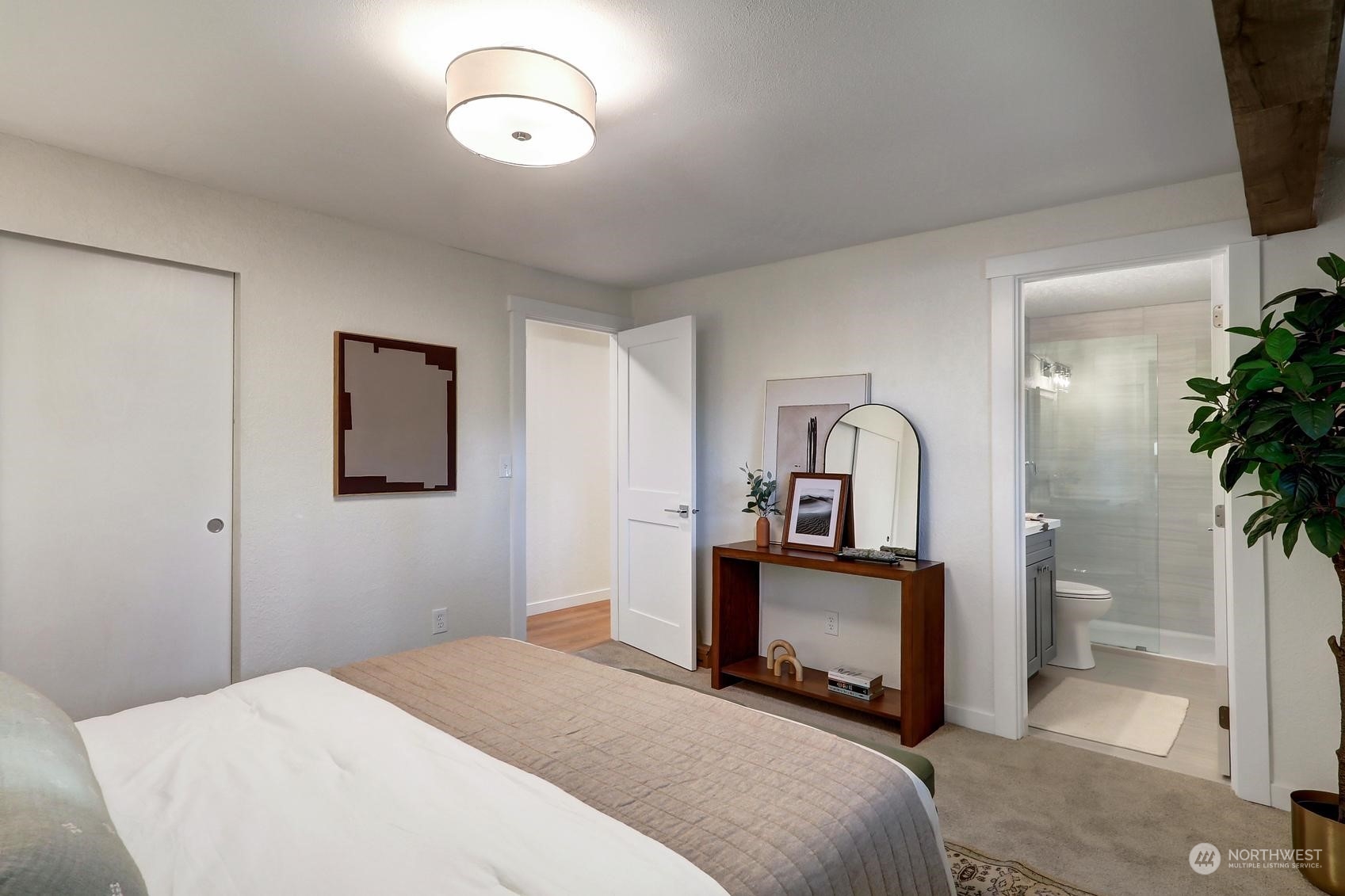 2029 Timber Trail Bothell, WA 98012 - Photo 10 of 24 a bedroom with a bed and a potted plant