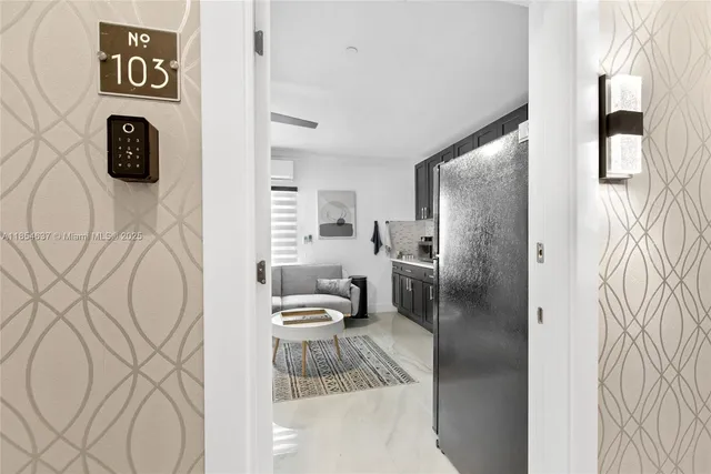 a bathroom with a toilet sink and shower