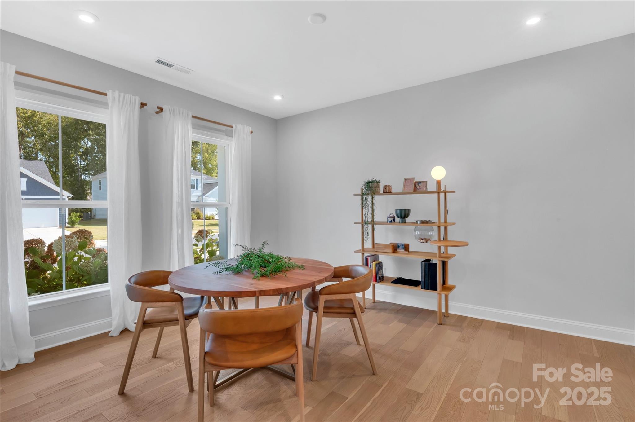 1185 Regions Boulevard Indian Land, SC 29707 - Photo 14 of 41 a view of a dining room with furniture window and wooden floor