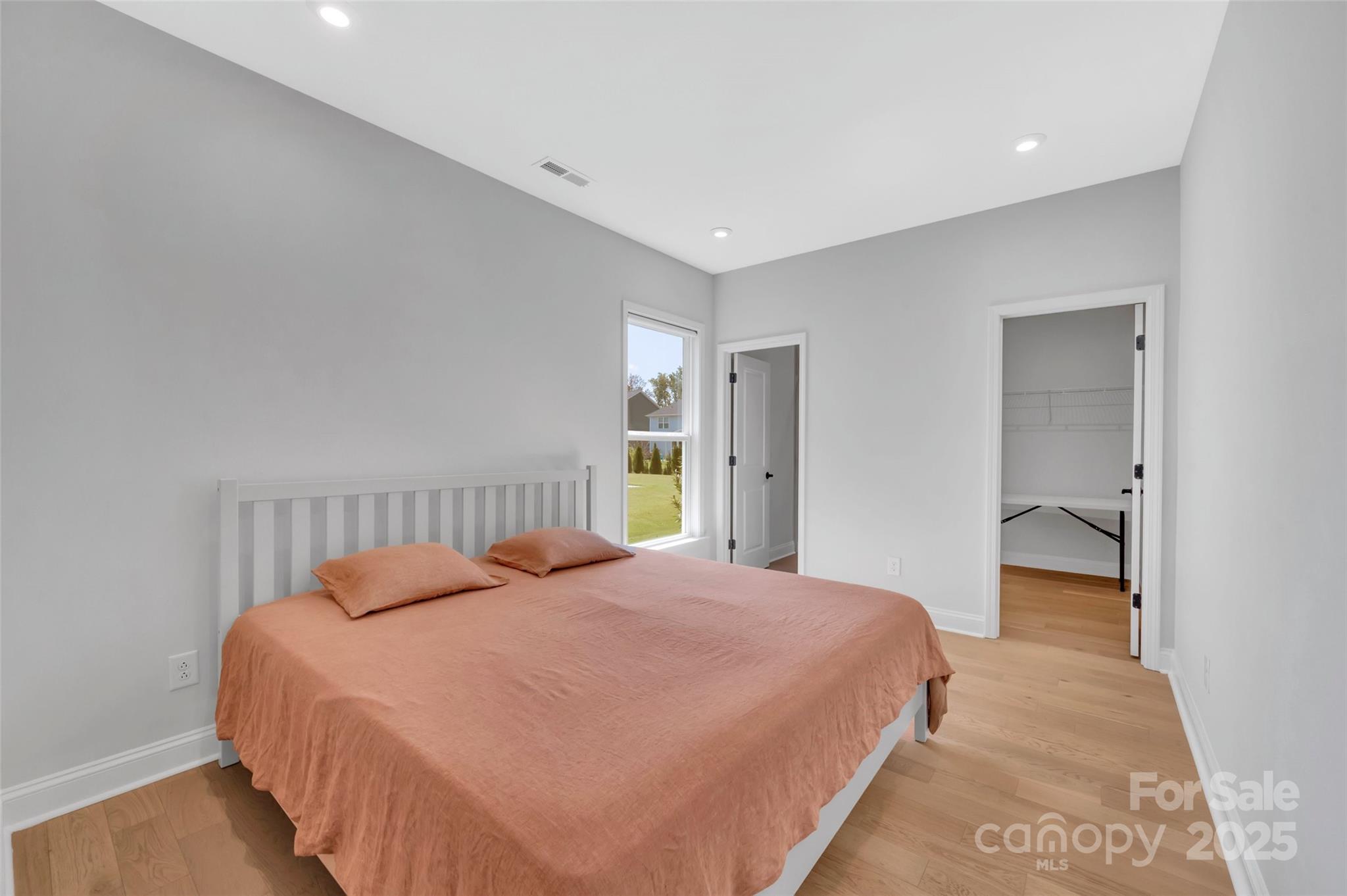 1185 Regions Boulevard Indian Land, SC 29707 - Photo 18 of 41 a bedroom with a large bed and a window